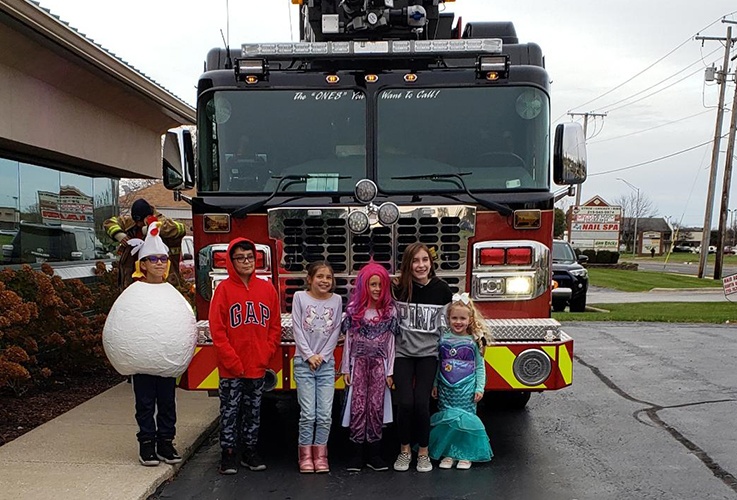 kids by fire truck