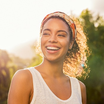 woman smiling in the sunlight
