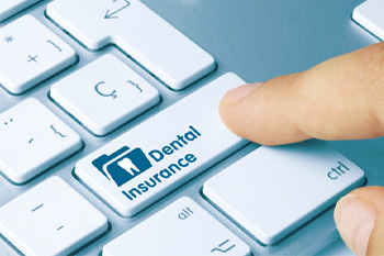 Finger about to press “Dental Insurance” key on keyboard
