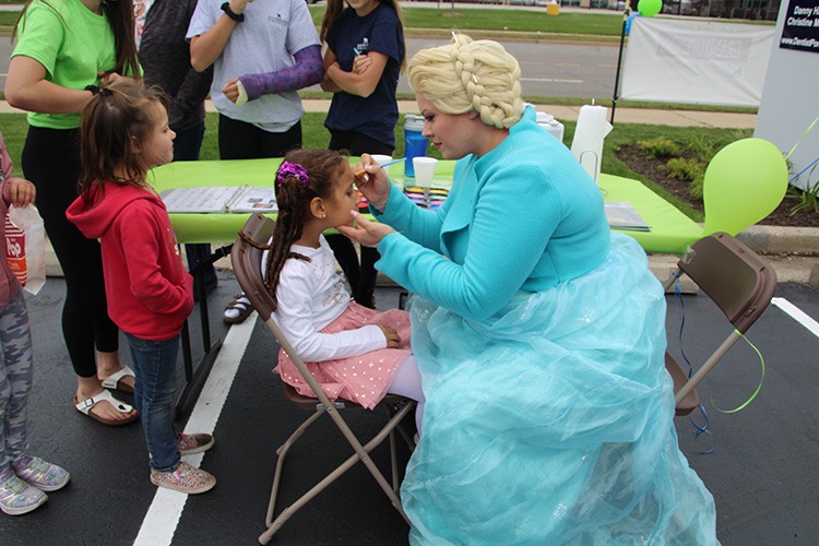 elsa painting little girl's face