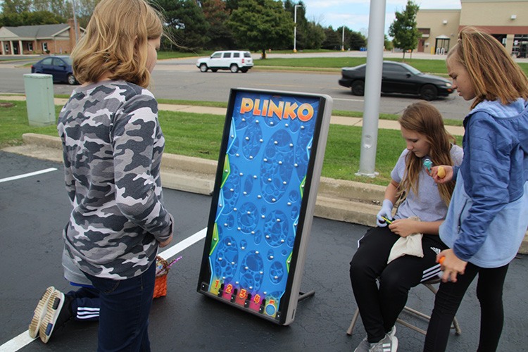 Kids playing plinko