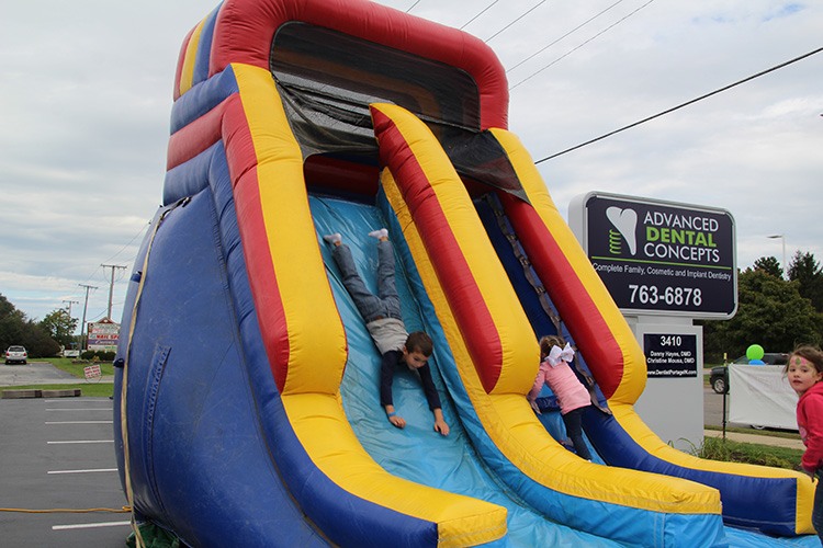 kids sliding down slide