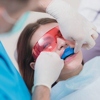 Young girl receiving dental treatment