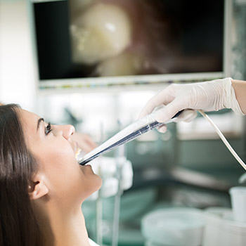 Dentist and patient looking at intraoral photos