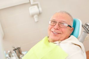 man has received dental implants in Portage