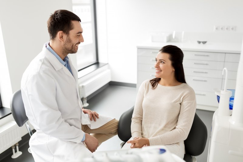 Woman at cosmetic dentist in Portage