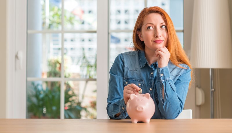 Woman and piggy bank