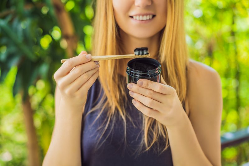 woman using activated charcoal in Portage