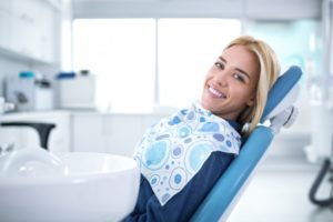 patient smiling in dental chair